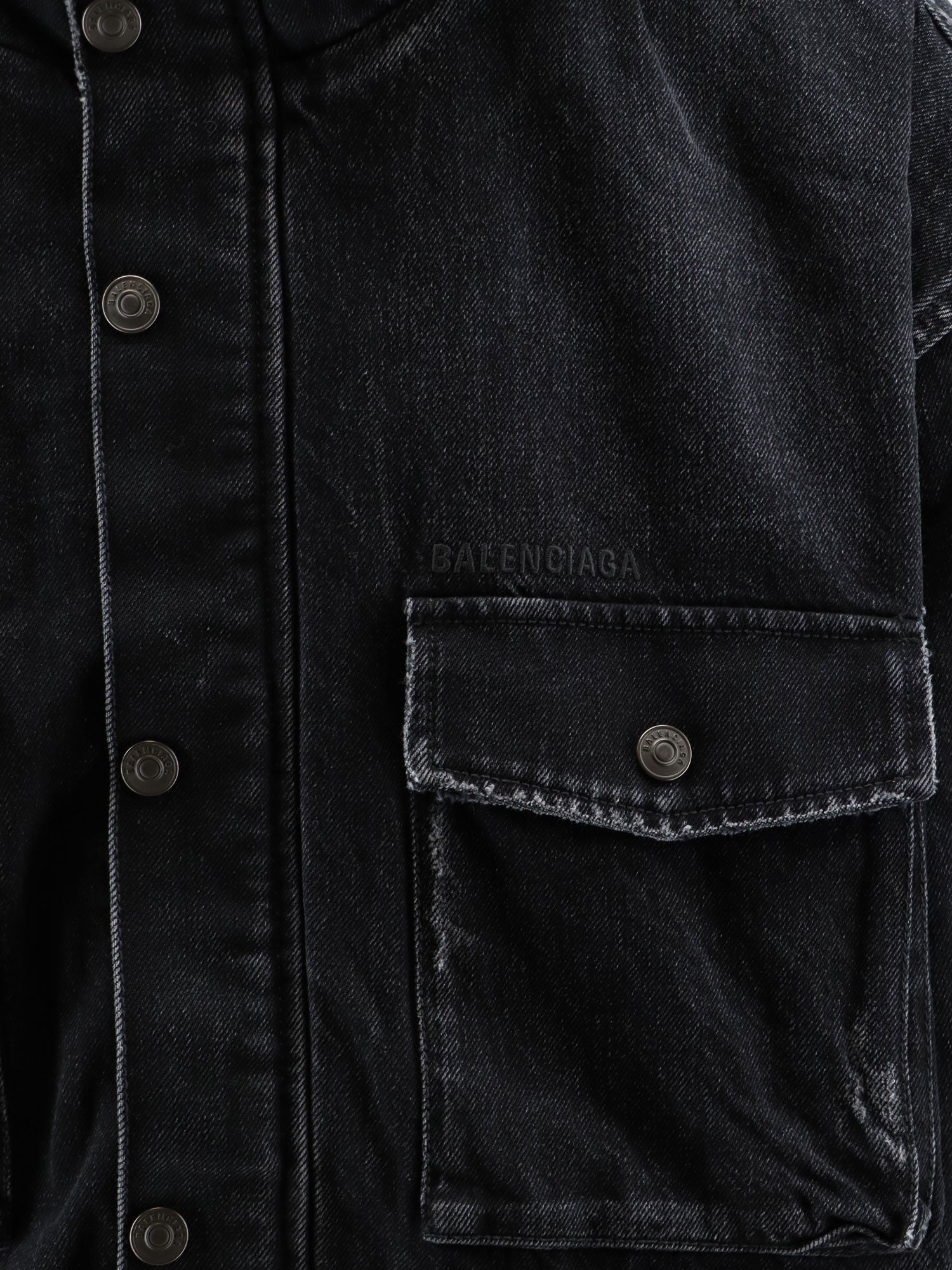 Black denim jacket with embroidered logo on the front