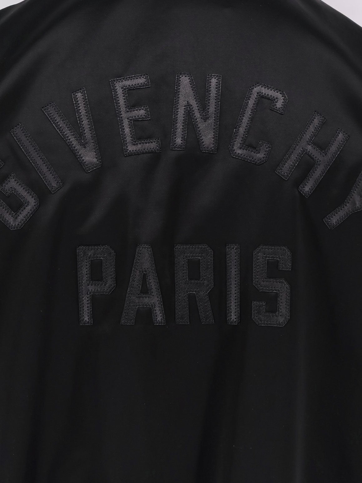 Cotton and nylon jacket with leather sleeves