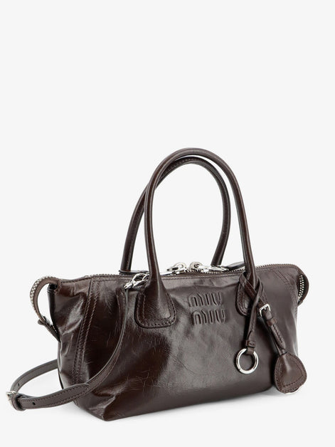 Leather handbag with embossed lettering logo