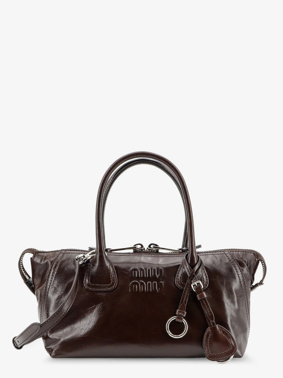 Leather handbag with embossed lettering logo