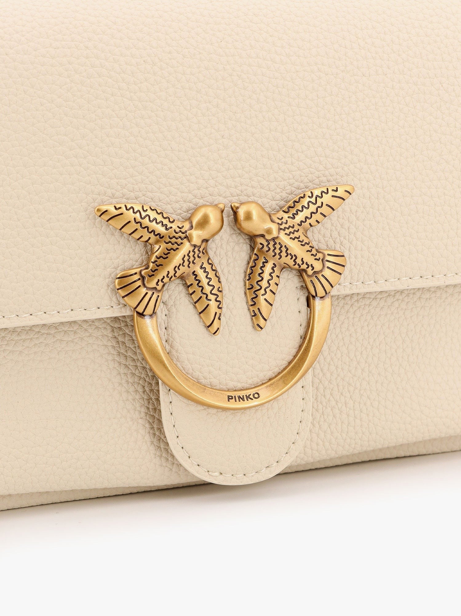 Leather shoulder bag with metal love birds buckle