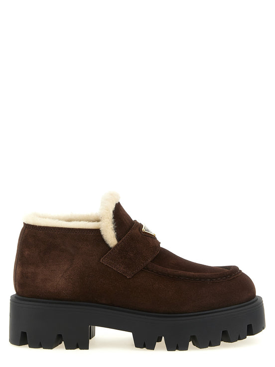 Loafers with fur and enamel logo
