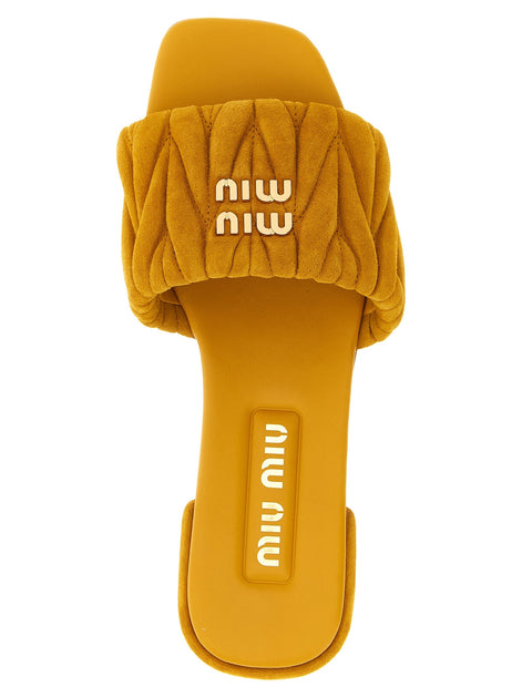 Matelassé suede slides