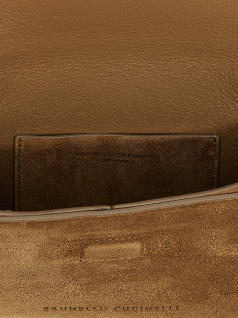 Monile suede clutch bag