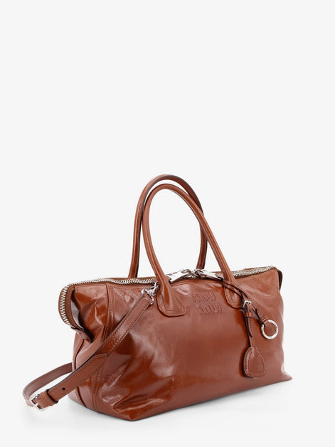 Shiny leather handbag with front lettering logo