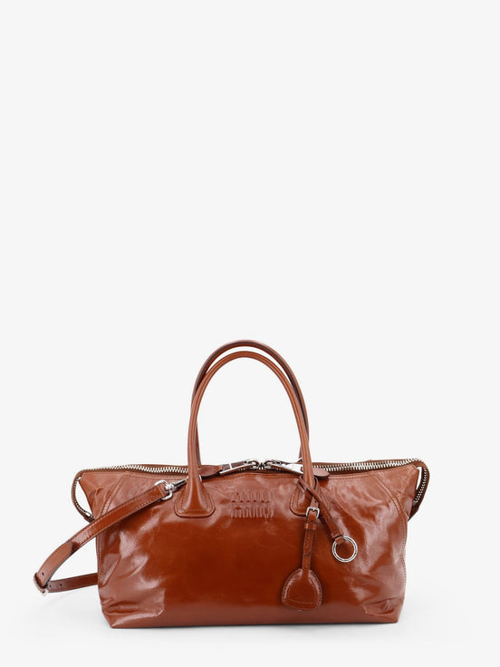 Shiny leather handbag with front lettering logo