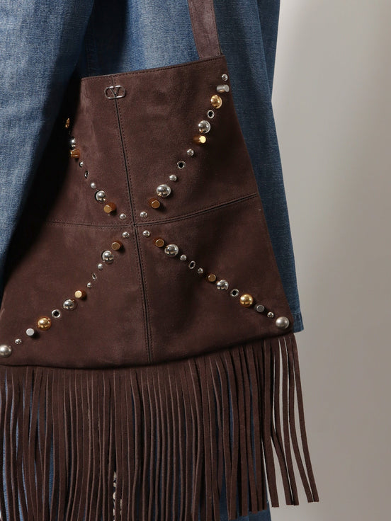 Suede shoulder bag with fringes and metal details